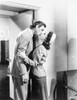 Johnny Weissmuller Kissing a Woman in a Classic Movie Scene Photo Print - Item # VARCEL709439