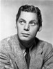Johnny Weissmuller wearing a Suit and a Black Necktie while Looking Up Photo Print - Item # VARCEL709442