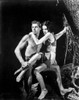 Johnny Weissmuller Carrying a Girl in a Movie Scene Photo Print - Item # VARCEL709444