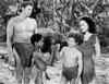 Johnny Weissmuller standing with Two Kids and a Woman in a Movie Scene Photo Print - Item # VARCEL709448