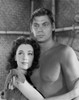 Johnny Weissmuller hugging a Woman while Topless Photo Print - Item # VARCEL709449