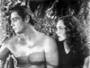 Johnny Weissmuller Being Looked Over by a Woman in a Classic Movie Scene Photo Print - Item # VARCEL709453