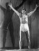Johnny Weissmuller wearing a White Shorts and Raising His Two Hands Photo Print - Item # VARCEL709461