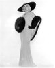 Mae West standing in Elegant Dress with Fur Design in The Center Photo Print - Item # VARCEL709620