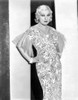 Mae West Looking Up in Black and White Dress with Hands on Hips Photo Print - Item # VARCEL709654