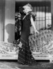 Mae West standing in Black Dress with Floral Sleeves Photo Print - Item # VARCEL709664