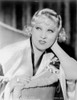 Mae West sitting in White Robe with Head Leaning on Hand Photo Print - Item # VARCEL709674