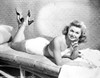 Esther Williams Lying on a Couch in White Dress smiling Photo Print - Item # VARCEL709865