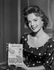 Natalie Wood Holding a Cookbook Photo Print - Item # VARCEL709960
