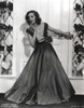 Loretta Young posed at the Door with Long Satin Gown Photo Print - Item # VARCEL710050