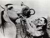 Audrey Hepburn putting the bridle on a horse Photo Print - Item # VARGLP348094