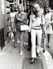 Brigitte Bardot on a sidewalk Photo Print (8 x 10)