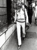 Brigitte Bardot on a sidewalk Photo Print (8 x 10)
