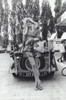 Brigitte Bardot by a car Photo Print (8 x 10)