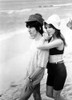 George Harrison and Patti Hansen at a beach Photo Print - Item # VARGLP357053