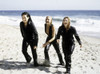Film still of Lucy Liu Cameron Diaz Drew Barrymore on a beach in Charlies Angels Photo Print (10 x 8)