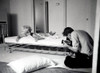 Marilyn Monroe lying on a bed Photo Print (10 x 8)