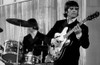 John Lennon playing a guitar Photo Print