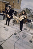 The Beatles performing on a rooftop Photo Print (8 x 10)