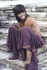 Jane Fonda sitting on a stone wall Photo Print - Item # VARGLP387480