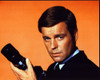 Robert Wagner Holding Camera With Orange Background Photo Print