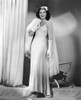 Jean Parker Modeling A White Chiffon Evening Gown With A Rhinestone-Buckled Cape And White Fox Throw 1937 Photo Print - Item # VAREVCPBDJEPAEC025H