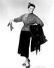 Desk Set Katharine Hepburn Modeling Outfit 1957. Tm And Copyright 20Th Century Fox Film Corp. All Rights Reserved. Courtesy: Everett Collection. Photo Print - Item # VAREVCPBDKAHEEC079H