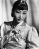 Anna May Wong In An Orange Nanking Brocade Robe With Sandalwood Fastenings 1937 Photo Print - Item # VAREVCPBDANMAEC045H
