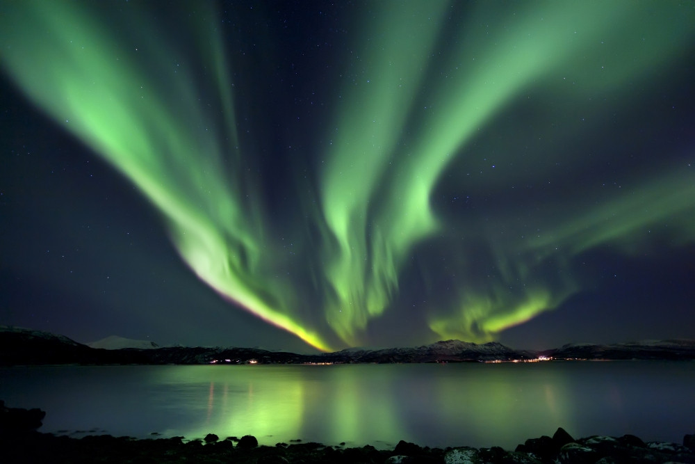 Aurora Borealis over Tjeldsundet in Troms County, Norway. Auroras