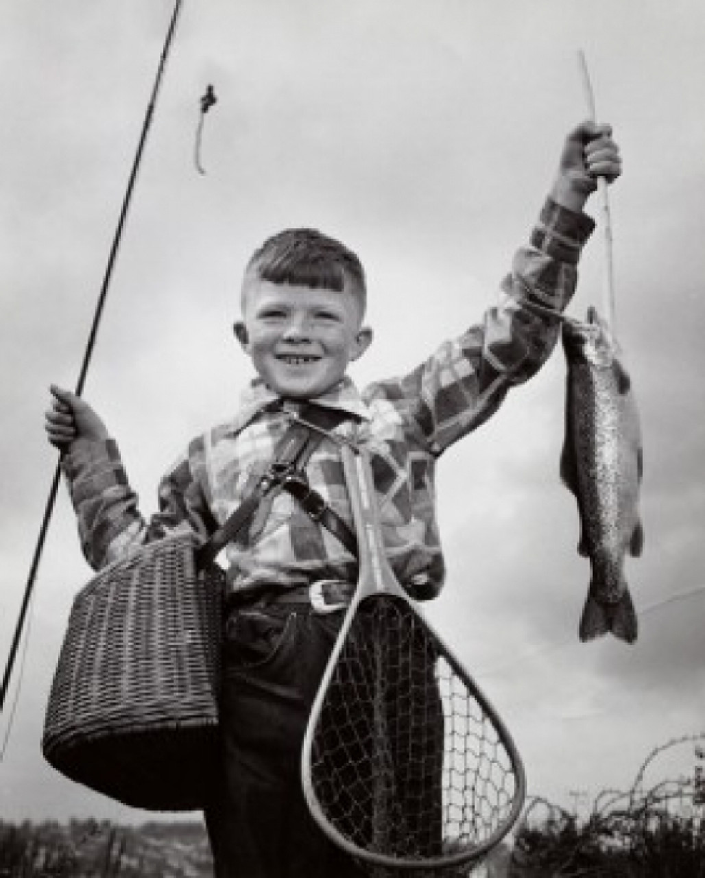 Portrait of a boy holding a dead fish and a fishing pole Poster