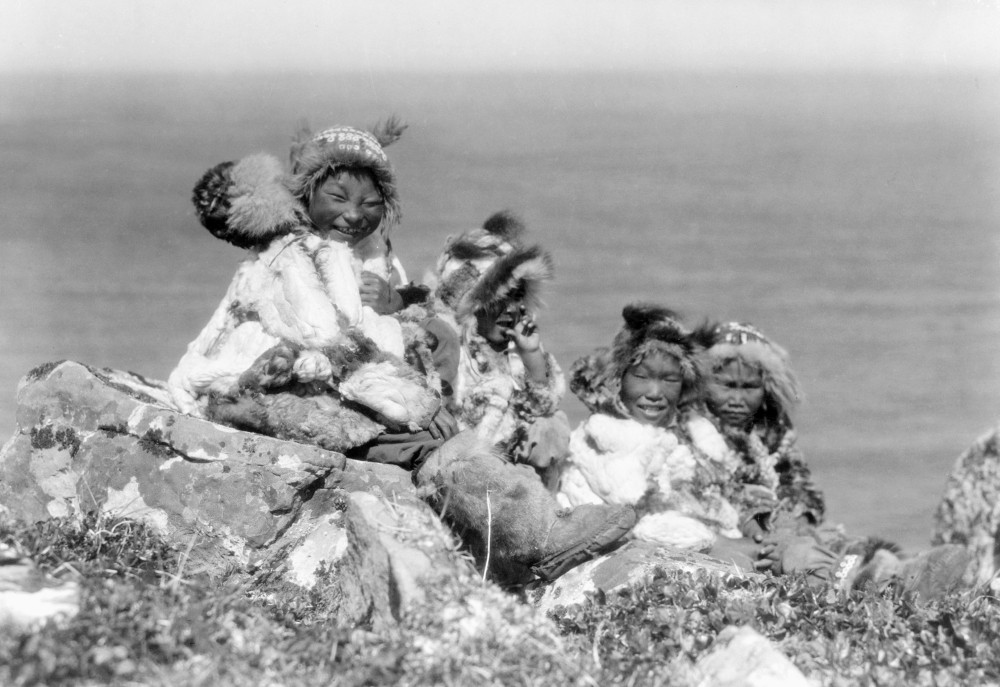 Alaska: Eskimos, C1929./Nfour Eskimo Children Sitting On The Edge Of ...
