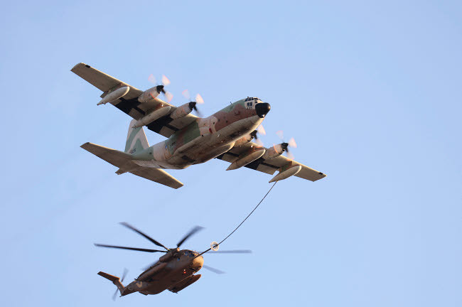 An Israeli Air Force KC-130H Karnaf refuels a CH-53 Yasur - Main Image