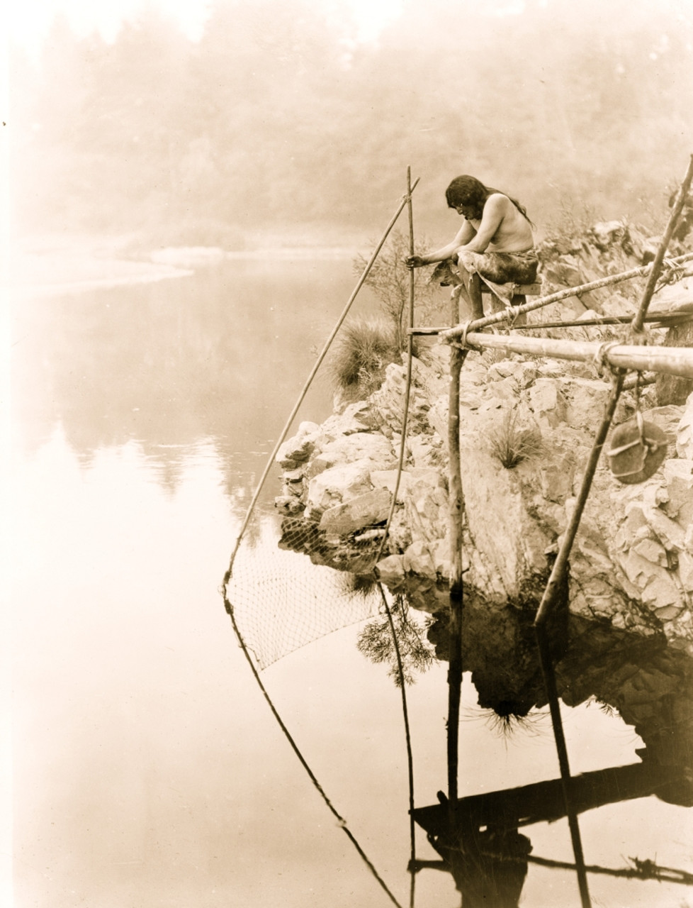 Hupa Indian on platform over water using fishing net. Poster Print - Item #  VARBLL058746858L