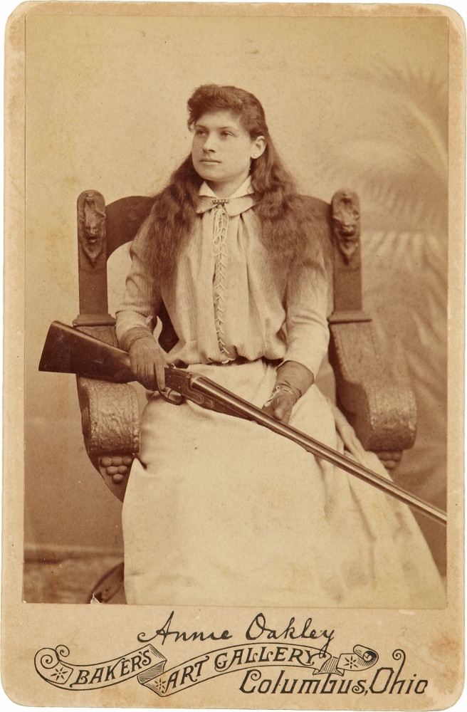 Annie Oakley:. Here The Legendary Sharpshooter Sits Rather