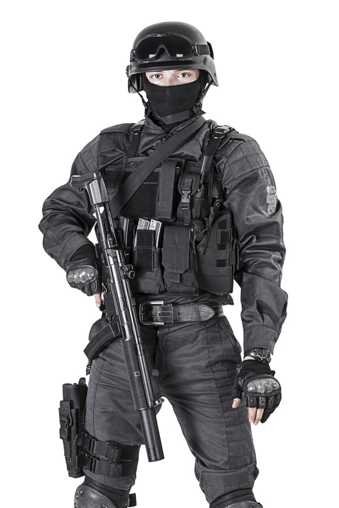 Spec ops police officer SWAT in black uniform, studio shot. Poster