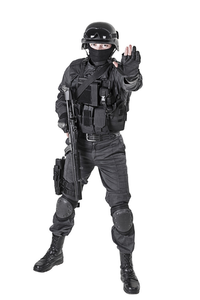 Spec ops police officer SWAT in black uniform, studio shot. Poster
