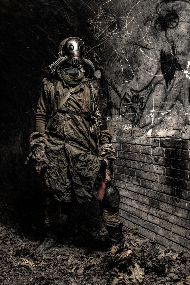 Post apocalyptic creature with machete, hiding in a dark dungeon