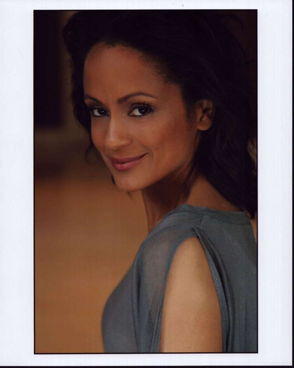Anne-Marie Johnson Looking Over Shoulder In Gray Top Photo Print - Item(04)