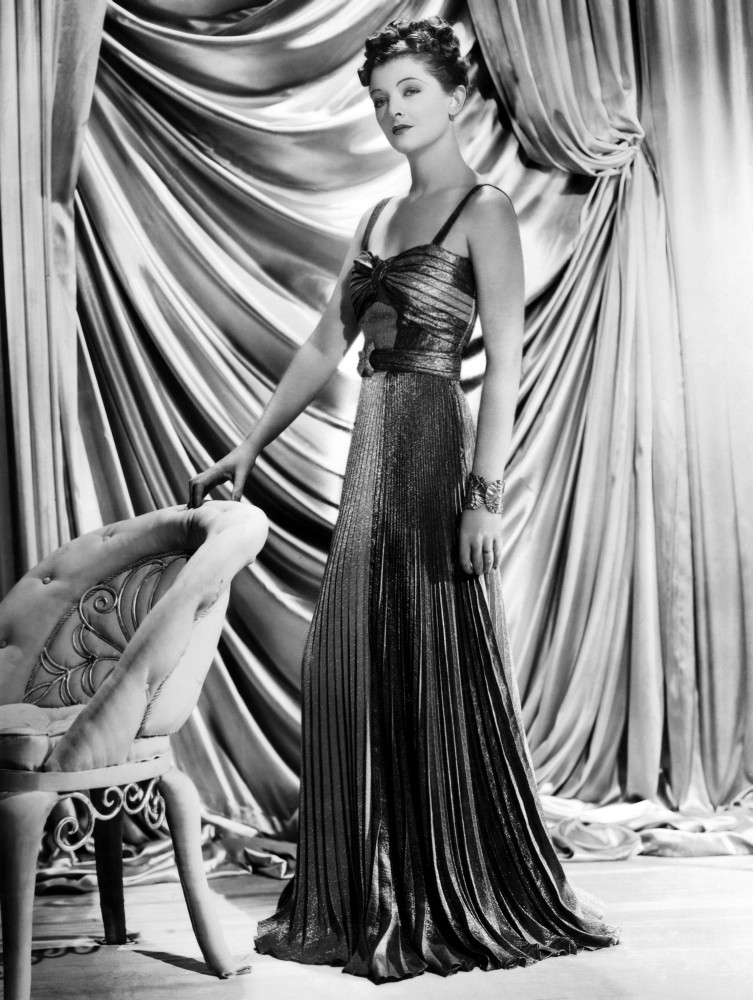 Myrna Loy Wearing Green And Yellow Gold Pleated Metallic Evening Gown 1938  Photo Print - Item # VAREVCPBDMYLOEC082H - Posterazzi