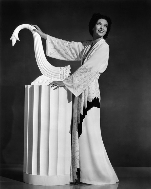 Kay Francis Modeling White-Crepe Lounging Robe With Crimson Trim 1937 Photo Print - Item # VAREVCPBDKAFREC051H