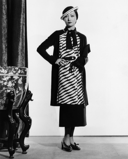 Limehouse Blues Anna May Wong In A Navy-And-White Silk Suit And Straw Hat 1934 Photo Print - Item # VAREVCMBDLINIEC008H Limehouse Blues Anna May Wong In A Navy-And-White Silk Suit And Straw Hat 1934 Photo Print - Item # VAREVCMBDLINIEC008H
