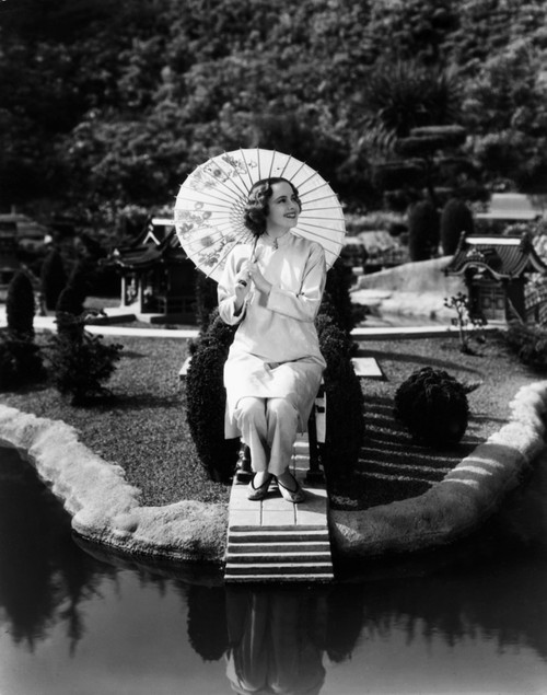 Olivia De Havilland In A Chinese Garden Ca. 1936 Photo Print - Item # VAREVCPBDOLDEEC173H
