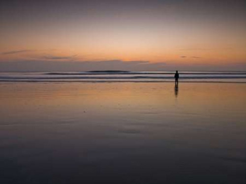Little boy standing on the beach at dusk Poster Print by  Assaf Frank - Item # VARPDXAF20111119029