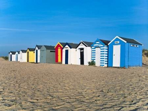 Beach huts in a row at sunrise Poster Print by  Assaf Frank - Item # VARPDXAF20090617266C03
