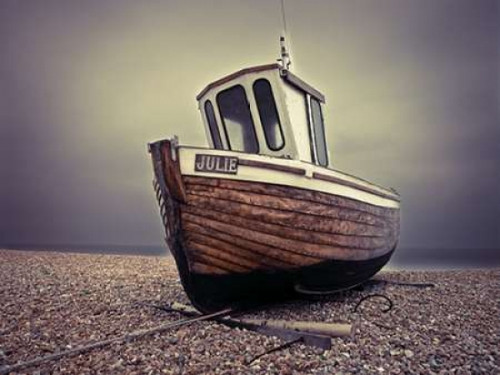 Boat moored on pebbled Beach Poster Print by  Assaf Frank - Item # VARPDXAF20100407004C06
