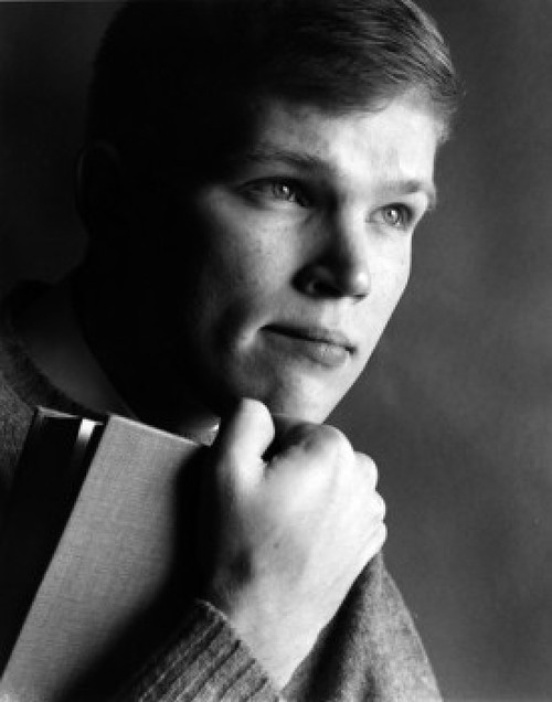 Portrait of teenage boy holding book Poster Print - Item # VARSAL25517552