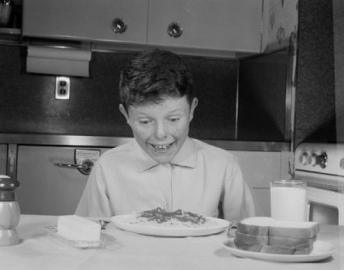 Portrait of boy eating spaghetti Poster Print - Item # VARSAL255416805