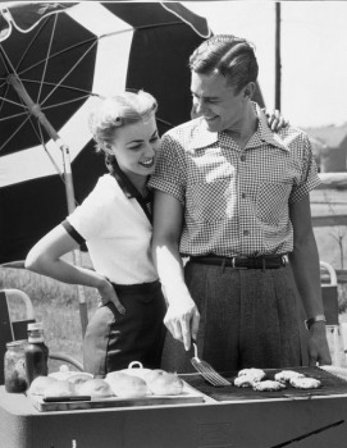 Young couple cooking food on barbecue grill Poster Print - Item # VARSAL2553000