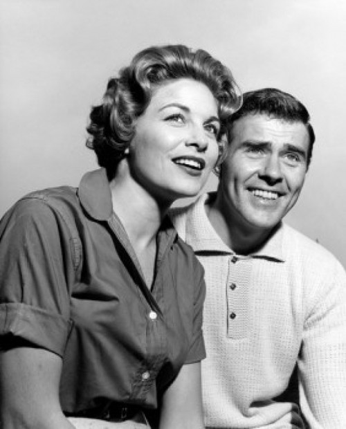 Studio portrait of mid adult couple smiling Poster Print - Item # VARSAL25549105