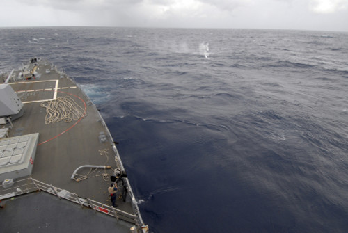 A sailor fires a .50-caliber machine gun aboard guided missile destroyer USS Nitze Poster Print - Item # VARPSTSTK104698M